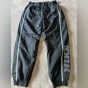 Nike Black Track Pants with White Side Piping and Logo